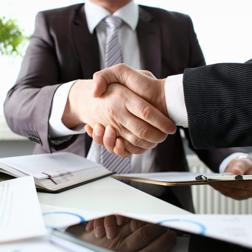 Business professionals discussing Bid Bond Guarantees and Tender Security Solutions